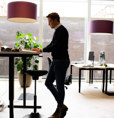 Office sales working at standing desk